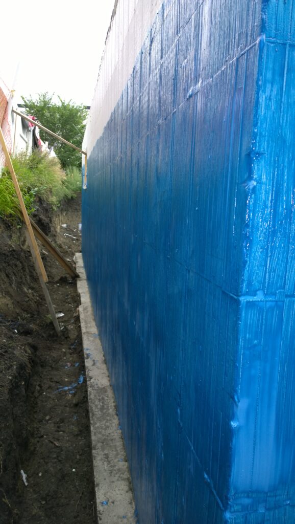 Blue Seal waterproofing membrane meticulously applied to the exterior surface of an Advantage ICF foundation wall, providing a robust barrier against moisture.