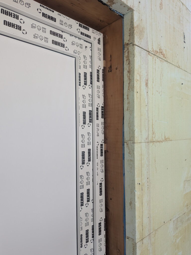 Embedded wood buck with interior and exterior insulation installed in an ICF wall opening in Edmonton.