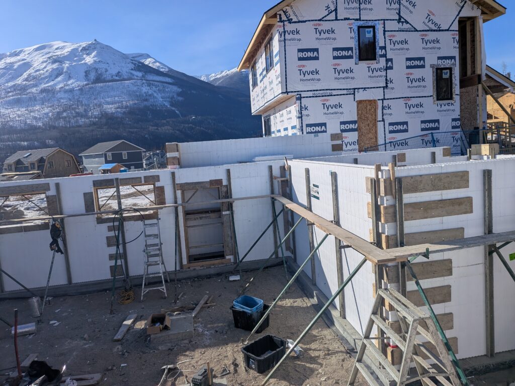 ICF basement foundation under construction in Edmonton showing insulated concrete form walls and a separate entrance opening before concrete placement.